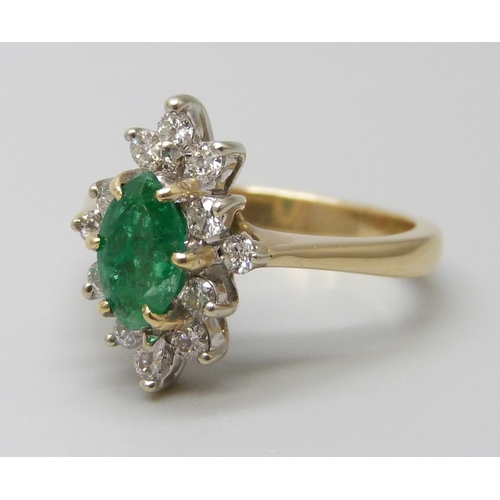 7057 - An 18ct gold, marquise cut emerald and diamond ring, very slight chip to emerald, 4.3g, L