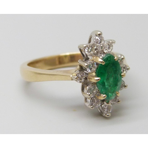 7057 - An 18ct gold, marquise cut emerald and diamond ring, very slight chip to emerald, 4.3g, L