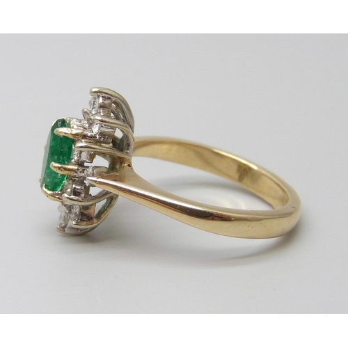 7057 - An 18ct gold, marquise cut emerald and diamond ring, very slight chip to emerald, 4.3g, L