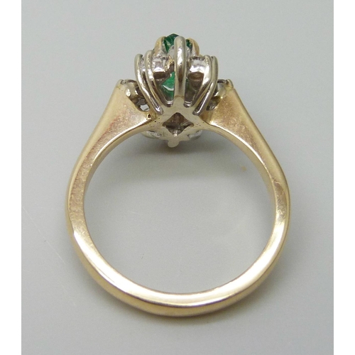 7057 - An 18ct gold, marquise cut emerald and diamond ring, very slight chip to emerald, 4.3g, L