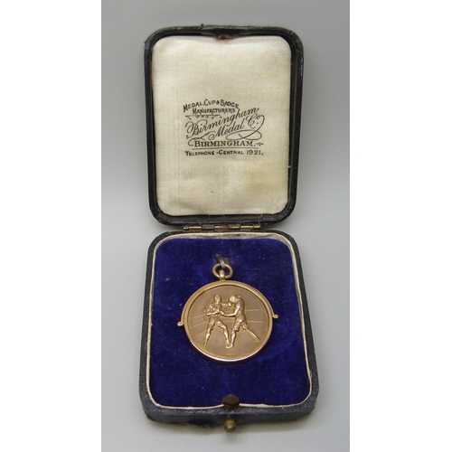 7058 - A 9ct gold Staffs Constabulary Boxing Tournament medal, 1929 Contest, cased, 15.2g