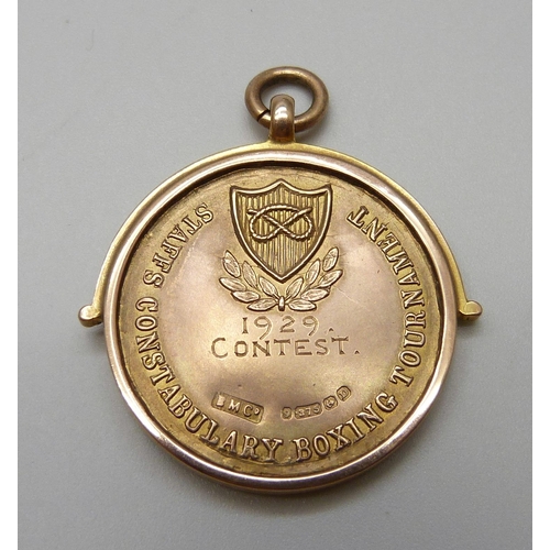 7058 - A 9ct gold Staffs Constabulary Boxing Tournament medal, 1929 Contest, cased, 15.2g