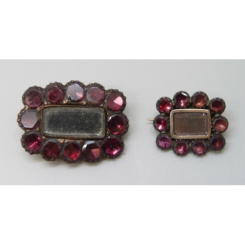 7060 - Two 19th Century yellow metal mourning brooches set with garnets, 3.9g, 2.4 x 1.8cm and 1.8g, 1.6 x ... 