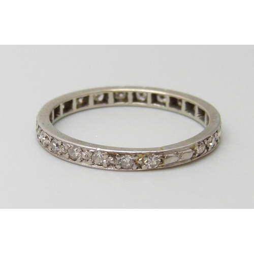 7062 - A white metal set diamond eternity ring, 2g, O