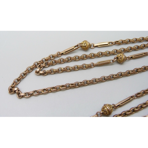 7069 - A 9ct gold fancy link long guard chain necklace, 26.6g, 142cm