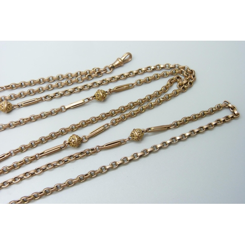 7069 - A 9ct gold fancy link long guard chain necklace, 26.6g, 142cm