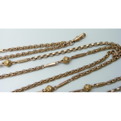 7069 - A 9ct gold fancy link long guard chain necklace, 26.6g, 142cm