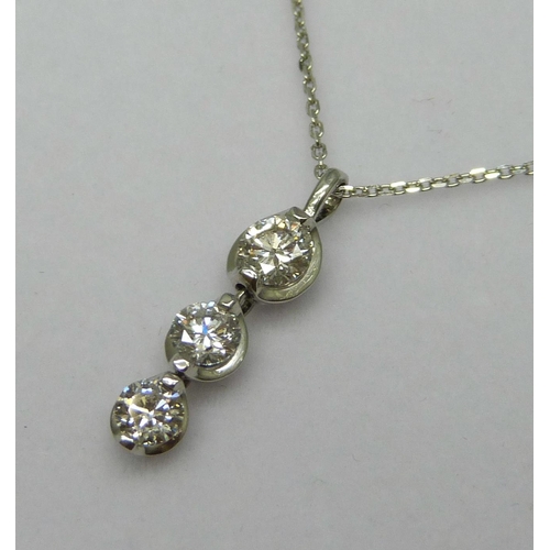 7075 - A platinum and diamond three stone pendant with adjustable length chain, 0.6ct total diamond weight ... 