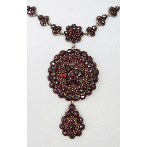 7081 - A Bohemian garnet cluster necklace, 22g, pendant 5cm, chain 40cm