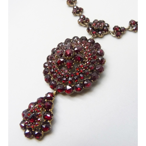 7081 - A Bohemian garnet cluster necklace, 22g, pendant 5cm, chain 40cm