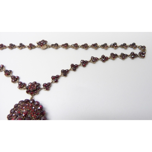 7081 - A Bohemian garnet cluster necklace, 22g, pendant 5cm, chain 40cm