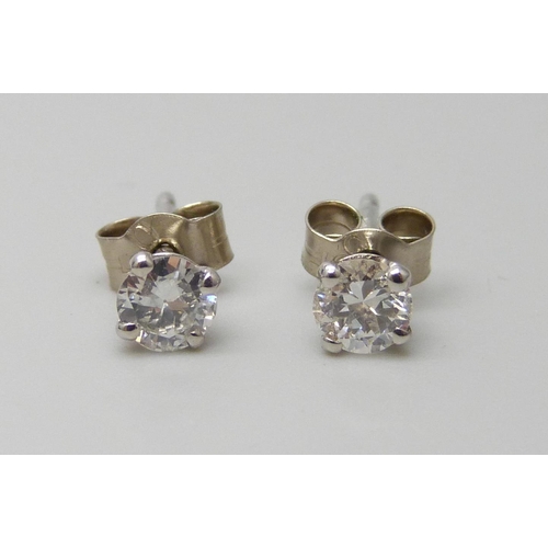 7082 - A pair of hallmarked 18ct white gold diamond stud earrings, total diamond weight 0.45ct