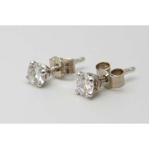 7082 - A pair of hallmarked 18ct white gold diamond stud earrings, total diamond weight 0.45ct