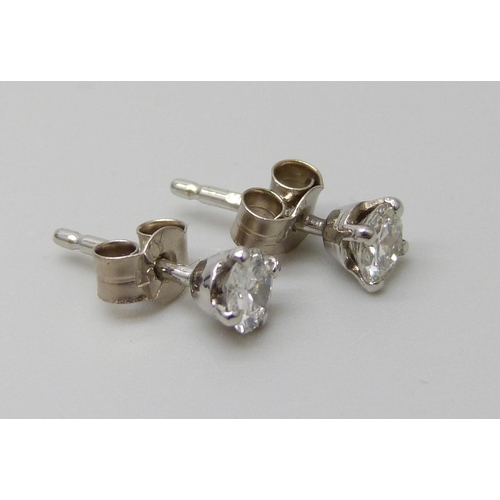 7082 - A pair of hallmarked 18ct white gold diamond stud earrings, total diamond weight 0.45ct