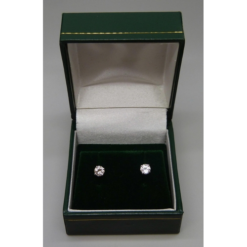 7082 - A pair of hallmarked 18ct white gold diamond stud earrings, total diamond weight 0.45ct