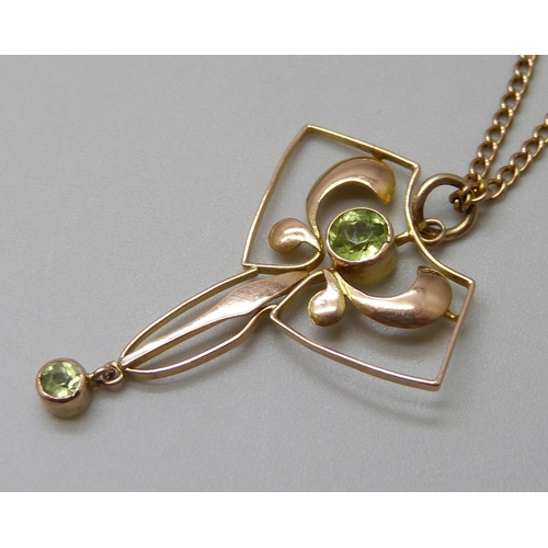 7088 - A 9ct gold Art Nouveau pendant set with peridot on a 9ct gold chain, 3.8g, pendant 3cm