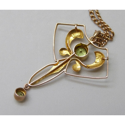 7088 - A 9ct gold Art Nouveau pendant set with peridot on a 9ct gold chain, 3.8g, pendant 3cm