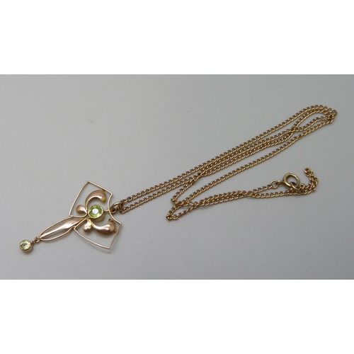 7088 - A 9ct gold Art Nouveau pendant set with peridot on a 9ct gold chain, 3.8g, pendant 3cm