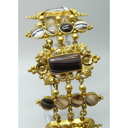 7089 - An early Victorian gilt metal and agate set panel bracelet, largest panels 2.4 x 4.5cm