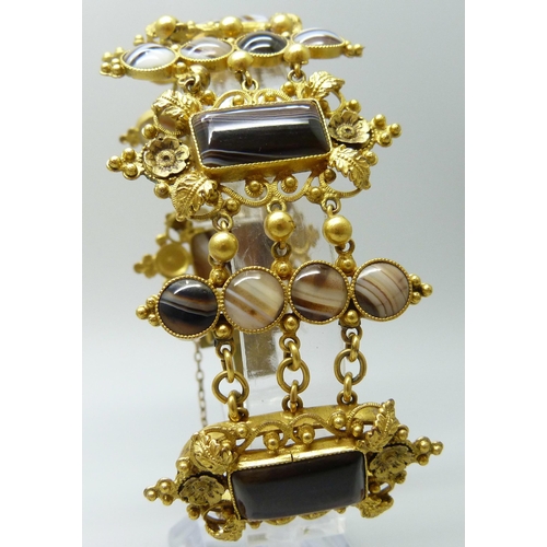 7089 - An early Victorian gilt metal and agate set panel bracelet, largest panels 2.4 x 4.5cm