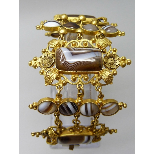 7089 - An early Victorian gilt metal and agate set panel bracelet, largest panels 2.4 x 4.5cm