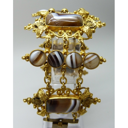 7089 - An early Victorian gilt metal and agate set panel bracelet, largest panels 2.4 x 4.5cm