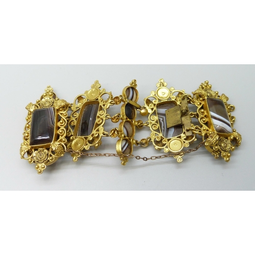 7089 - An early Victorian gilt metal and agate set panel bracelet, largest panels 2.4 x 4.5cm