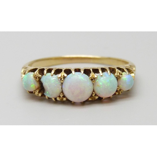 7093 - A yellow metal five stone opal ring, one opal a/f (chipped), 3g, O