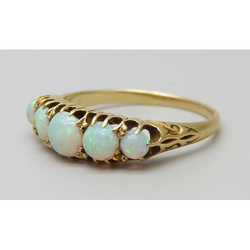 7093 - A yellow metal five stone opal ring, one opal a/f (chipped), 3g, O