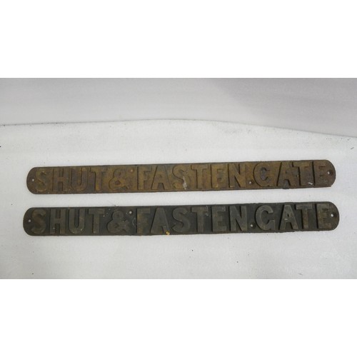 9041 - Two cast iron signs from a railway crossing inscribed SHUT & FASTEN GATE. Measure 7.5 x 85cm HxW. To... 