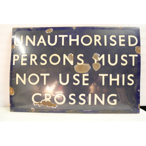 9049 - An LNER flangeless enamel railway sign on wooden frame UNAUTHORISED PERSONS MUST NOT USE THIS CROSSI... 