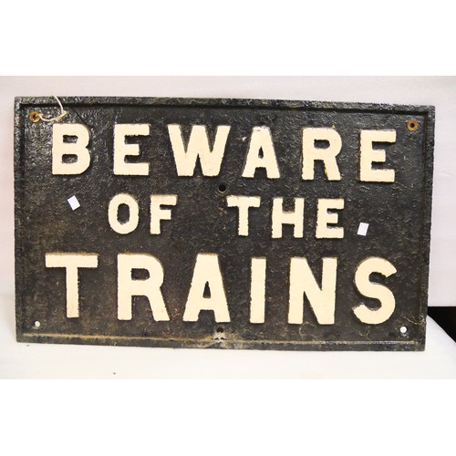 9052 - A railway cast iron sign BEWARE OF THE TRAINS. Measures 47 x 79cm HxW. To be sold with no reserve.