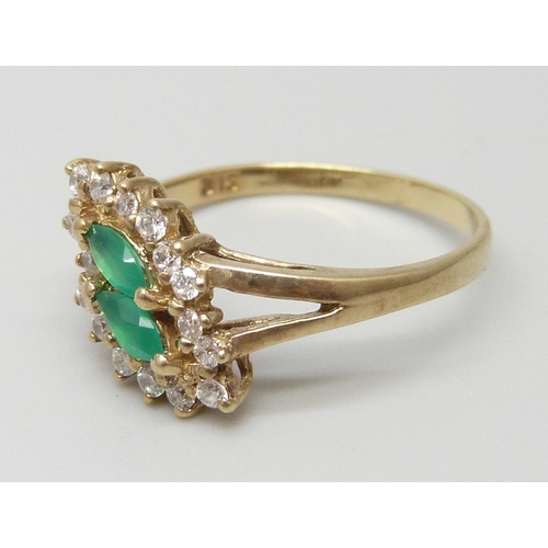 7099 - A 9ct gold, emerald and white stone cluster ring, 2.5g