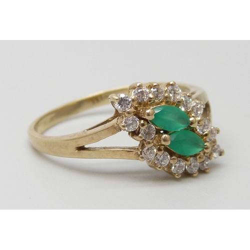 7099 - A 9ct gold, emerald and white stone cluster ring, 2.5g