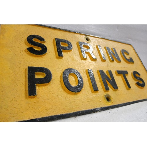 9067 - A cast iron railway sign SPRING POINTS. Measures 31 x 61cm HxW. To be sold with no reserve.