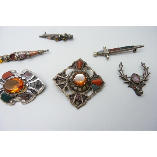 7105 - Scottish hardstone set jewellery including four silver brooches and a large white metal brooch, silv... 