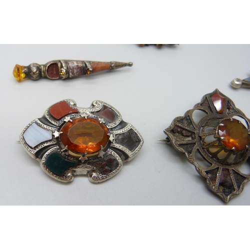 7105 - Scottish hardstone set jewellery including four silver brooches and a large white metal brooch, silv... 