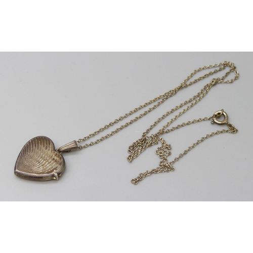 7113 - A Georg Jensen silver heart locket on a chain, 4.5g, 2.5cm including bale