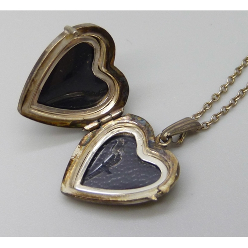 7113 - A Georg Jensen silver heart locket on a chain, 4.5g, 2.5cm including bale