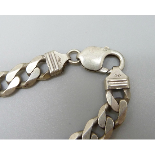 7116 - A silver curb link necklace and three silver bracelets, 155g, necklace 51cm and largest bracelet 23.... 