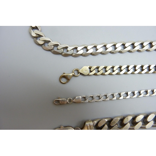 7116 - A silver curb link necklace and three silver bracelets, 155g, necklace 51cm and largest bracelet 23.... 