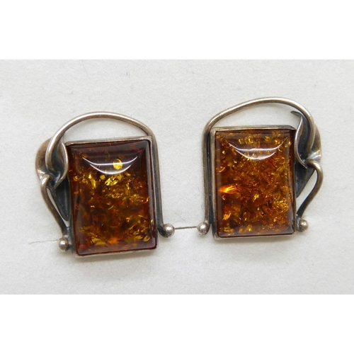 7123 - A pair of silver and amber clip on earrings in an Art Nouveau style frame, 7.2g