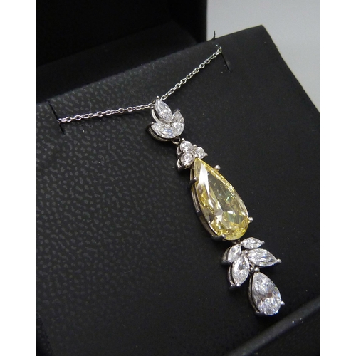 7129 - A yellow Swarovski cubic zirconia pendant by Cavandish French, 5.1g, 4.cm