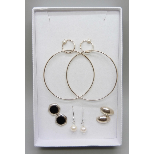 7130 - Four pairs of silver earrings including large hoops and pearls, 8g