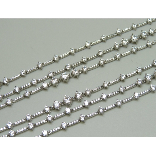 7137 - A 925 silver rhodium plated stone set 3 strand necklace set with Swarovski cubic zirconia, made by C... 