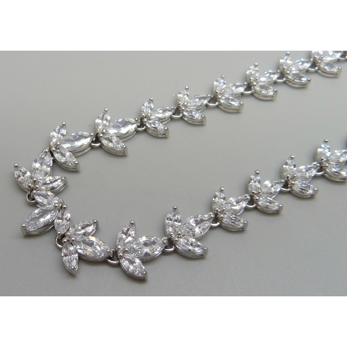 7138 - A silver necklace set with marquise cut cubic zirconia with a stone set clasp, 23.5g, 41cm