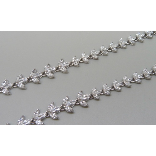 7138 - A silver necklace set with marquise cut cubic zirconia with a stone set clasp, 23.5g, 41cm