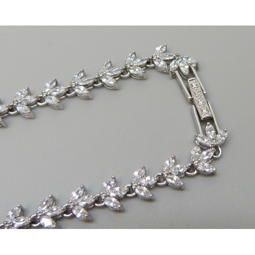 7138 - A silver necklace set with marquise cut cubic zirconia with a stone set clasp, 23.5g, 41cm