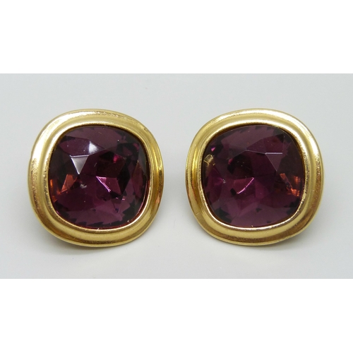 7151 - A pair of large Yves Saint Laurent clip on earrings with faceted purple stones, signed YSL, 2.8cm