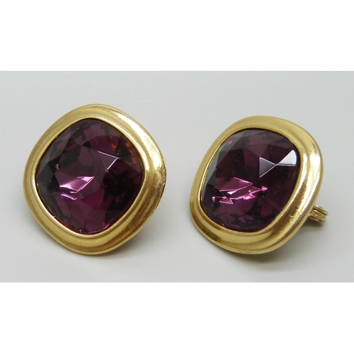 7151 - A pair of large Yves Saint Laurent clip on earrings with faceted purple stones, signed YSL, 2.8cm